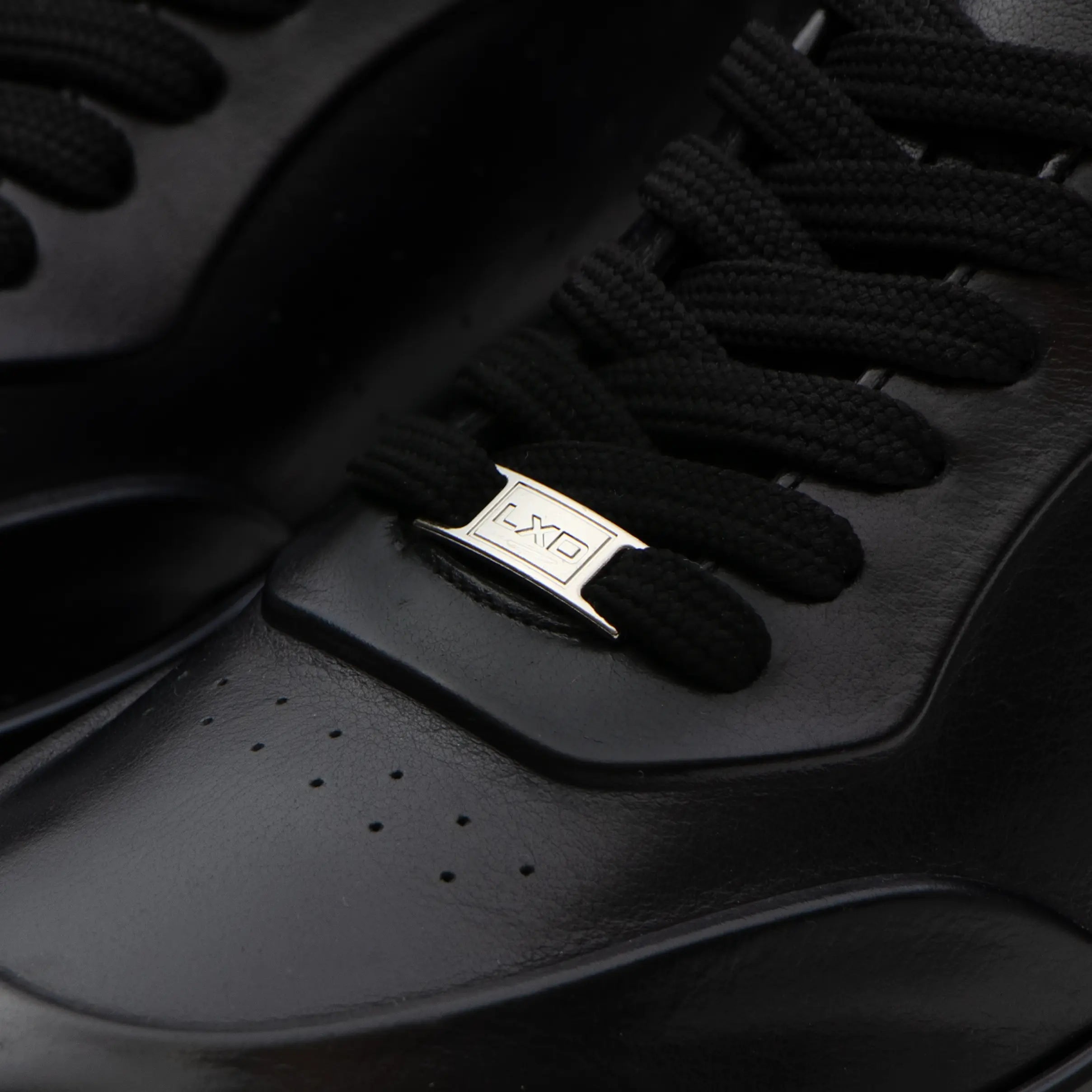 L'EXUDE PurNoir height-increasing elevator casual shoes, color black, shown in a close-up view