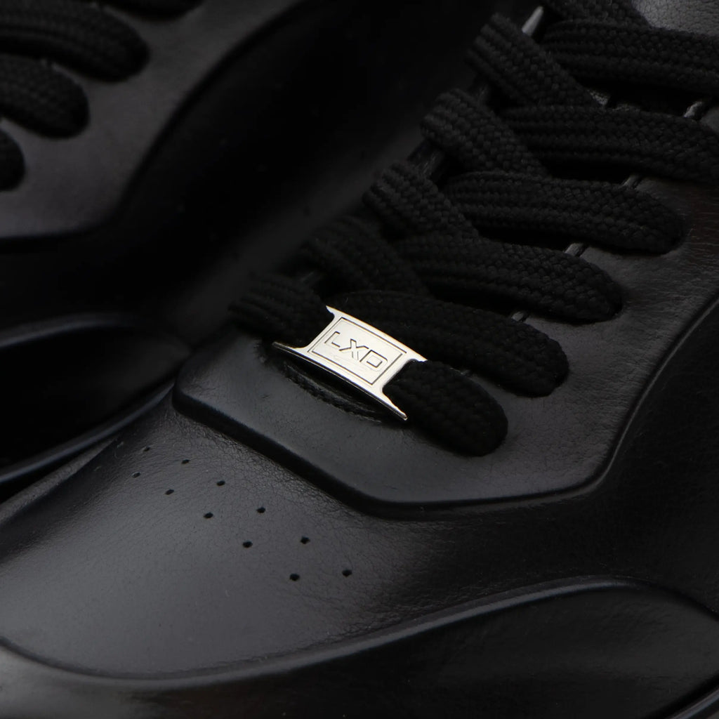 L'EXUDE PurNoir height-increasing elevator casual shoes, color black, shown in a close-up view