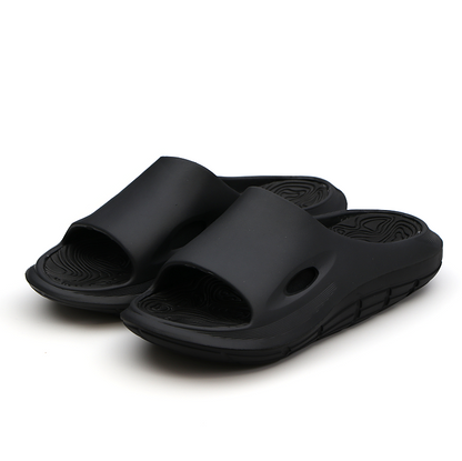 L'EXUDE RAPTOR height-increasing elevator slippers, color black, shown in a perspective view